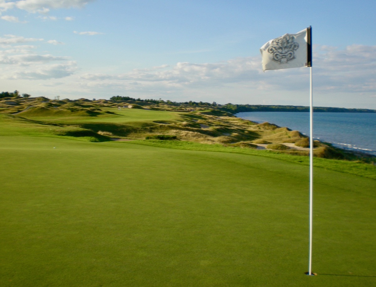 The wind whistling through the flag at Whistling Straits                               